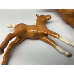 Collection of Beswick horses, including grey horse no.701, palomino foal no 836, grey stocky jogging mare no.855 etc, together two Royal Doulton horses, (8)