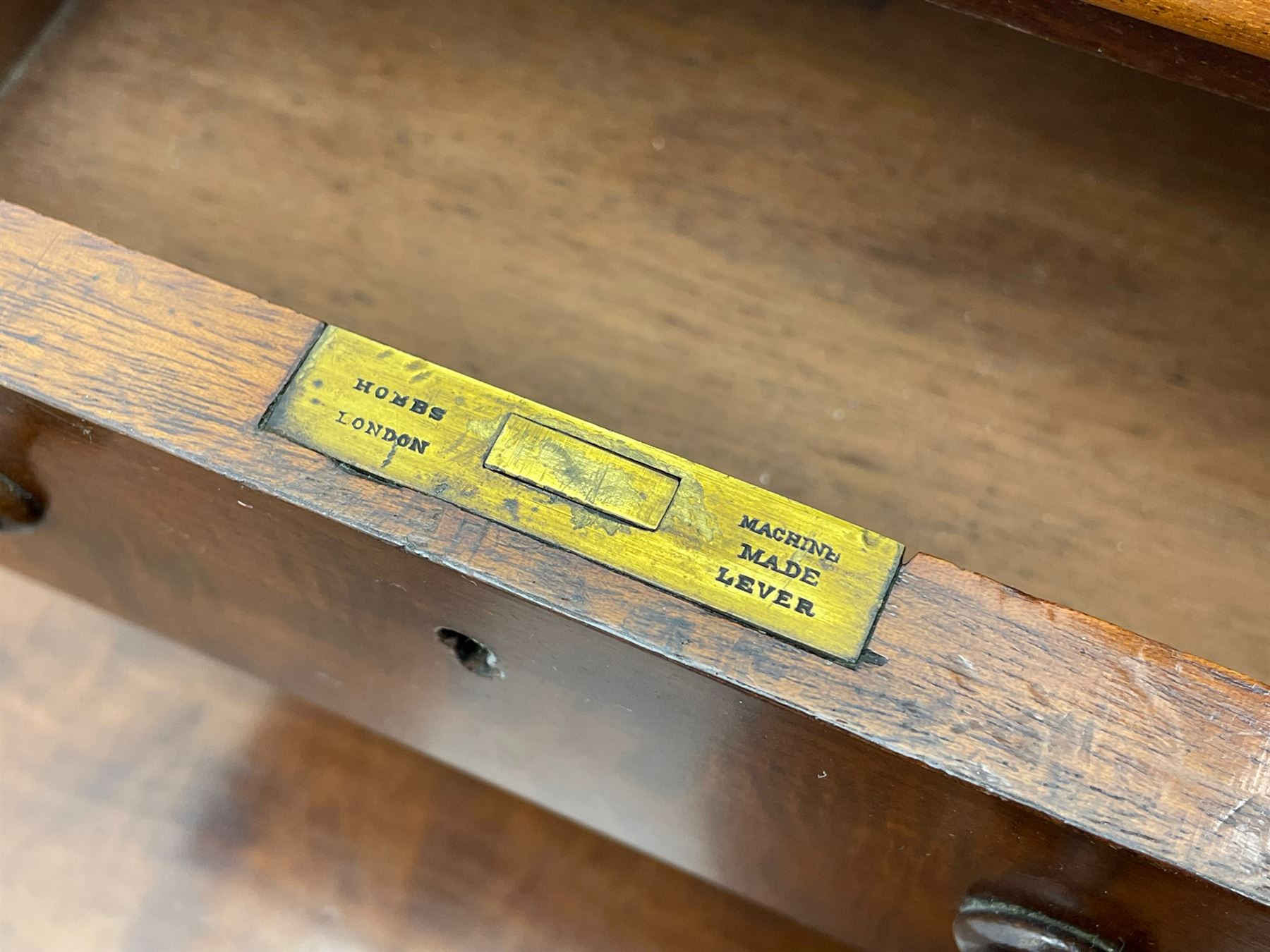 Victorian figured mahogany two-piece bedroom set - the washstand with white and black marble moulded top with arched back and raised shelf, two moulded frieze drawers, on turned and fluted supports with brass and ceramic castors (W123cm, D60cm, H102cm); the dressing table with raised swing mirror in moulded frame with shell and scroll carved pediment, on scrolled horns carved with foliage, four raised trinket drawers over moulded rectangular top, fitted with two drawers, on turned and fluted supports with brass and ceramic castors (W122cm, H177cm, D62cm)