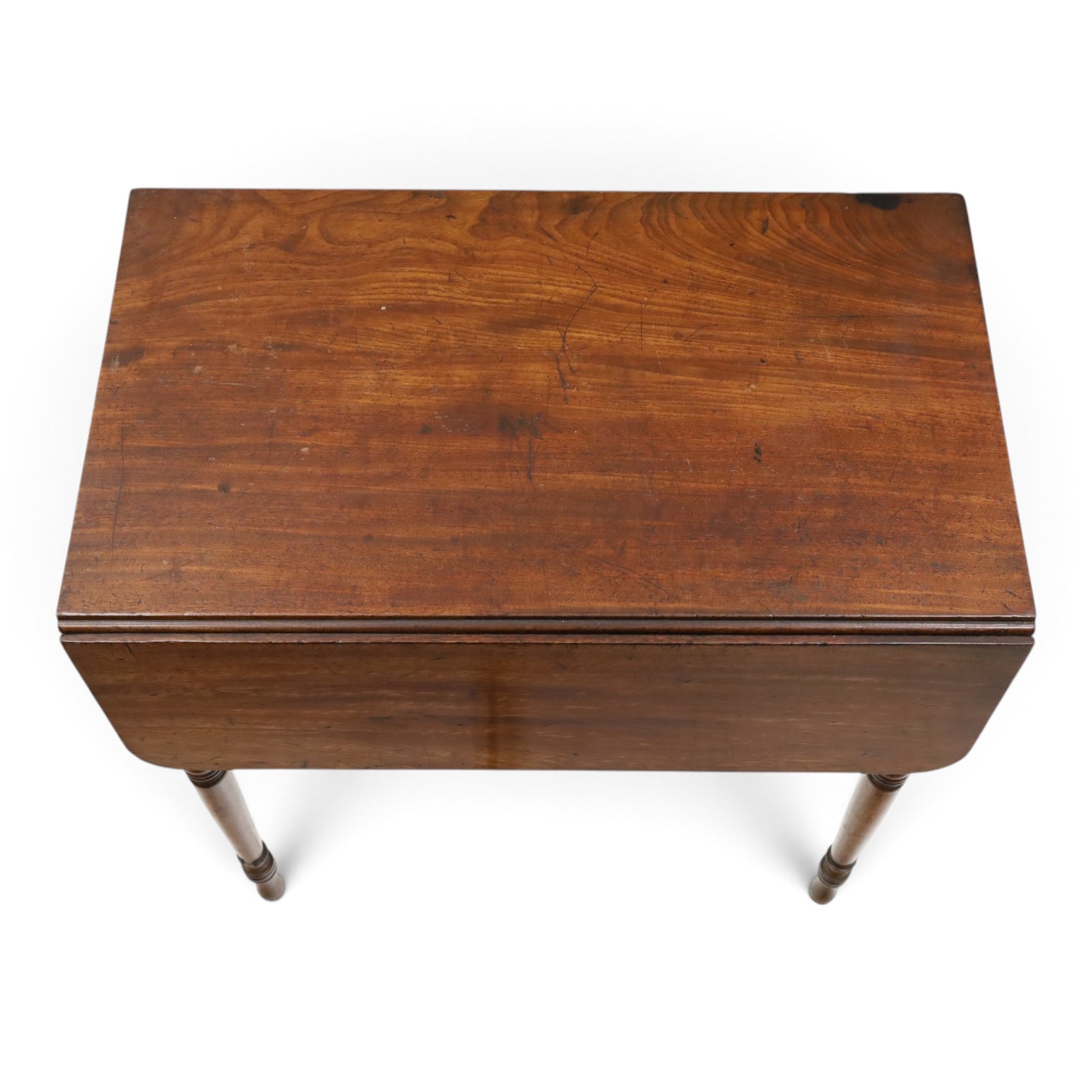 Early 19th century mahogany deception table with drop-front, rectangular top over drop-front with button action to the side, enclosing slatted-base compartment, raised on turned supports