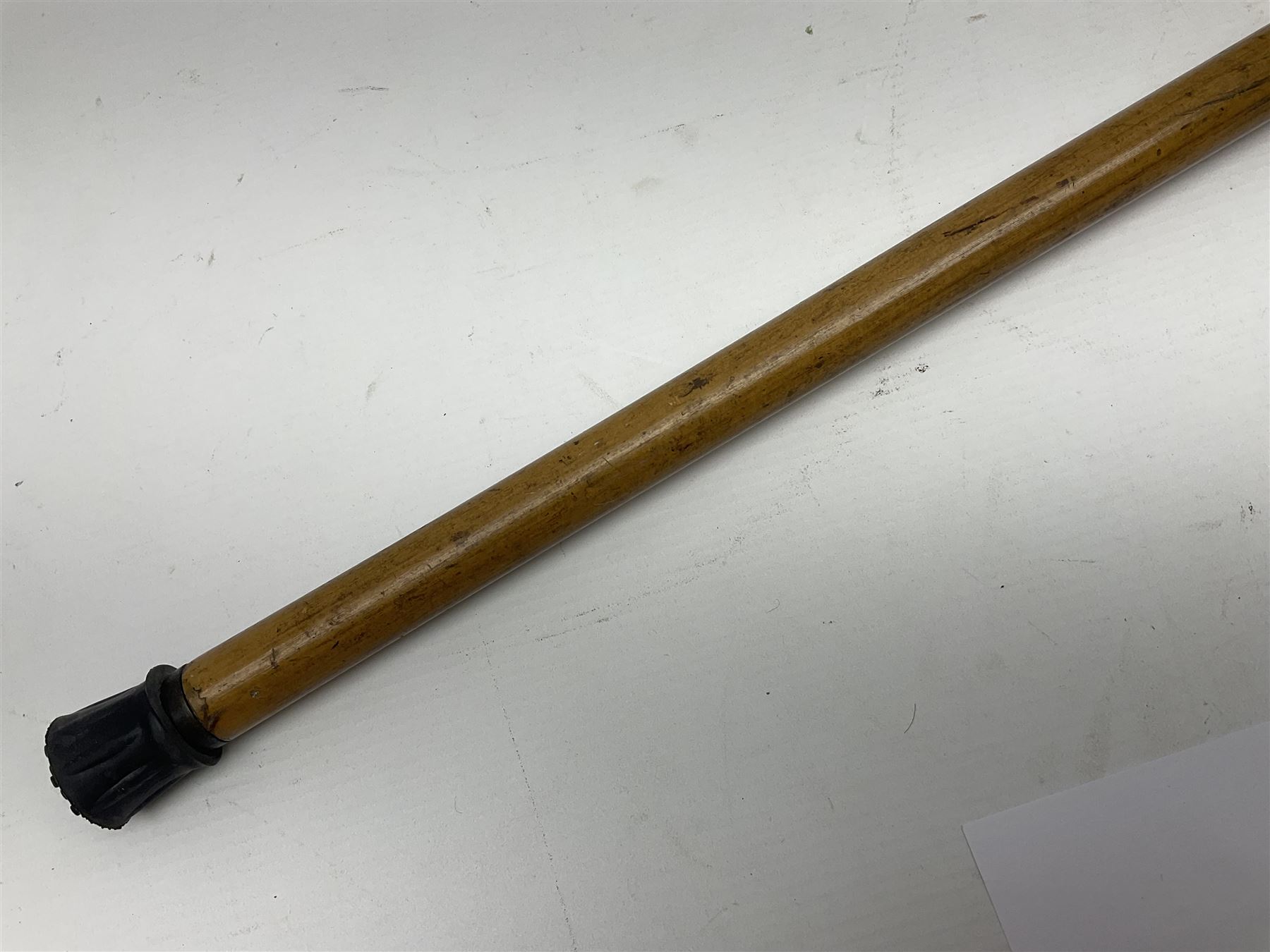 Malacca walking cane, with domed Burmese silver pommel embossed with deities, L91.5cm