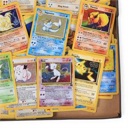 Collection of  Wizards Of The Coast Pokemon trading cards including Base Set, Jungle Set, Fossil Set and Team Rocket examples, black star promo Mew, Arcanine and Pikachu, holo Ninetales and Clefairy, 1st edition pre-release holo Aerodactyl, Team Rocket Dark Machamp holo and Jungle set Flareon, Vaporeon and Scyther holos 