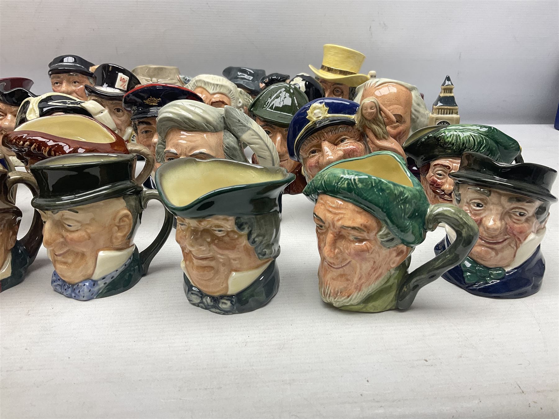 Large collection of Royal Doulton miniature character jugs, to include The Postman D6801, The London 'Bobby' D6762, Old Salt, D6554, Sir Henry Doulton D6703 etc  