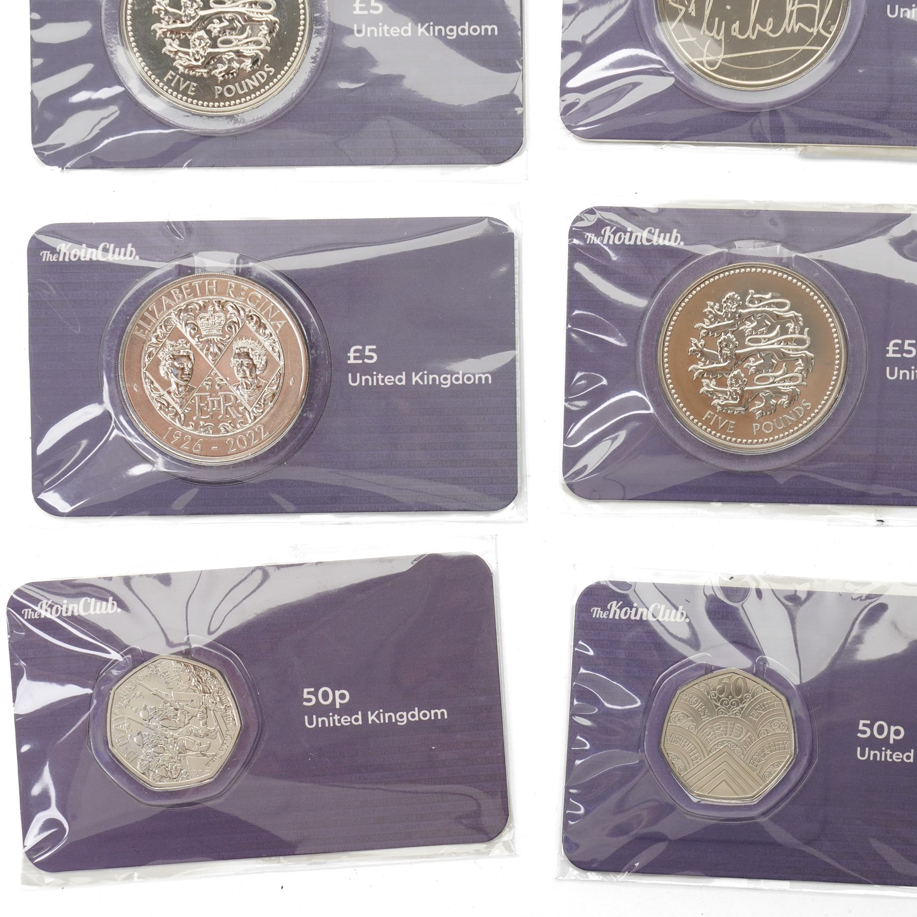 Nine Elizabeth II and Charles III £5 coins, five 50p coins, five Soloman Islands half dollar coins and other coins