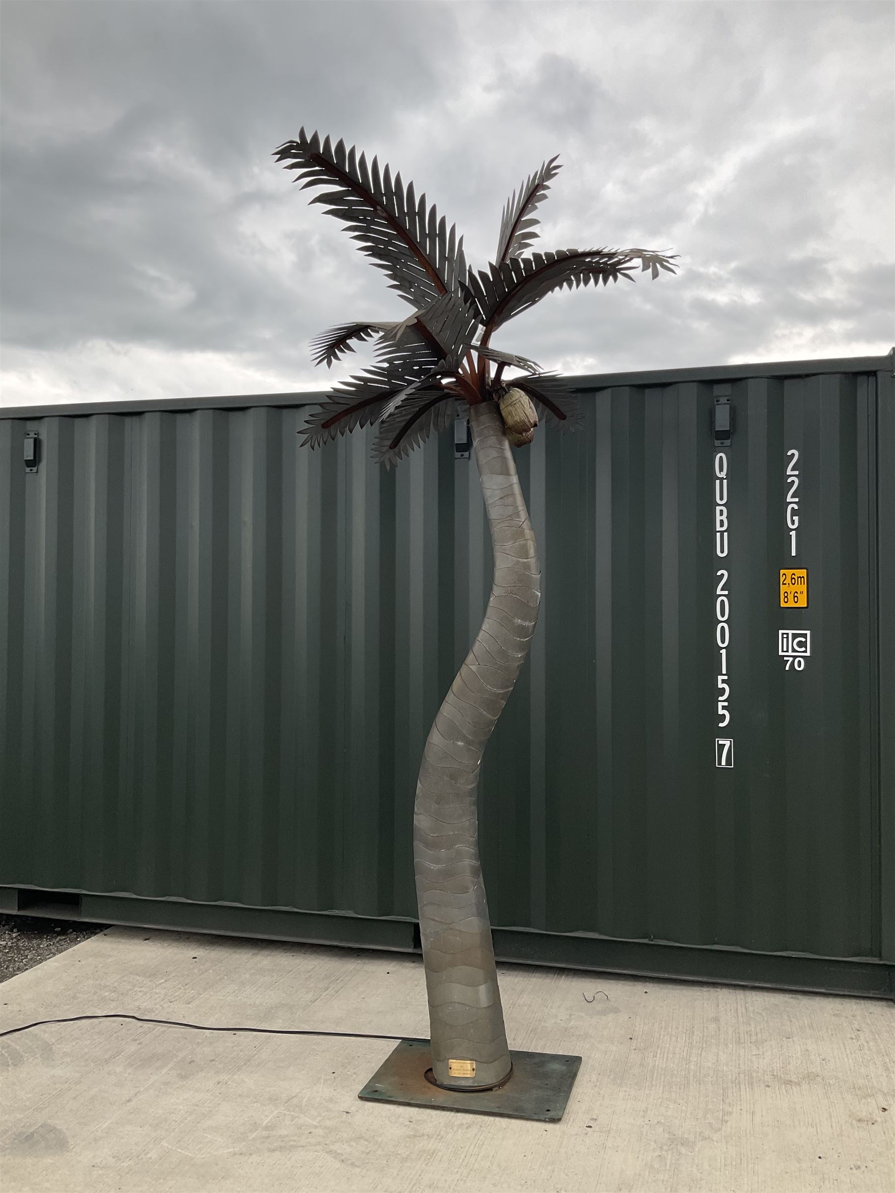 Designer Palms - shaped metal full size palm tree, double curved trunk with large metal fronds and pair of coconut lights, on rectangular base - THIS LOT IS TO BE COLLECTED BY APPOINTMENT FROM DUGGLEBY STORAGE, GREAT HILL, EASTFIELD, SCARBOROUGH, YO11 3TX