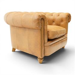 Alexander James - Chesterfield tan armchair, button backed with scrolled arms, brass studded trim raised on light wood turned feet