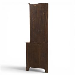 19th century oak floor-standing corner display cabinet, dentil cornice above astragal glass, shaped fixed shelves, the lower section with twin cupboard doors, on shaped bracket feet