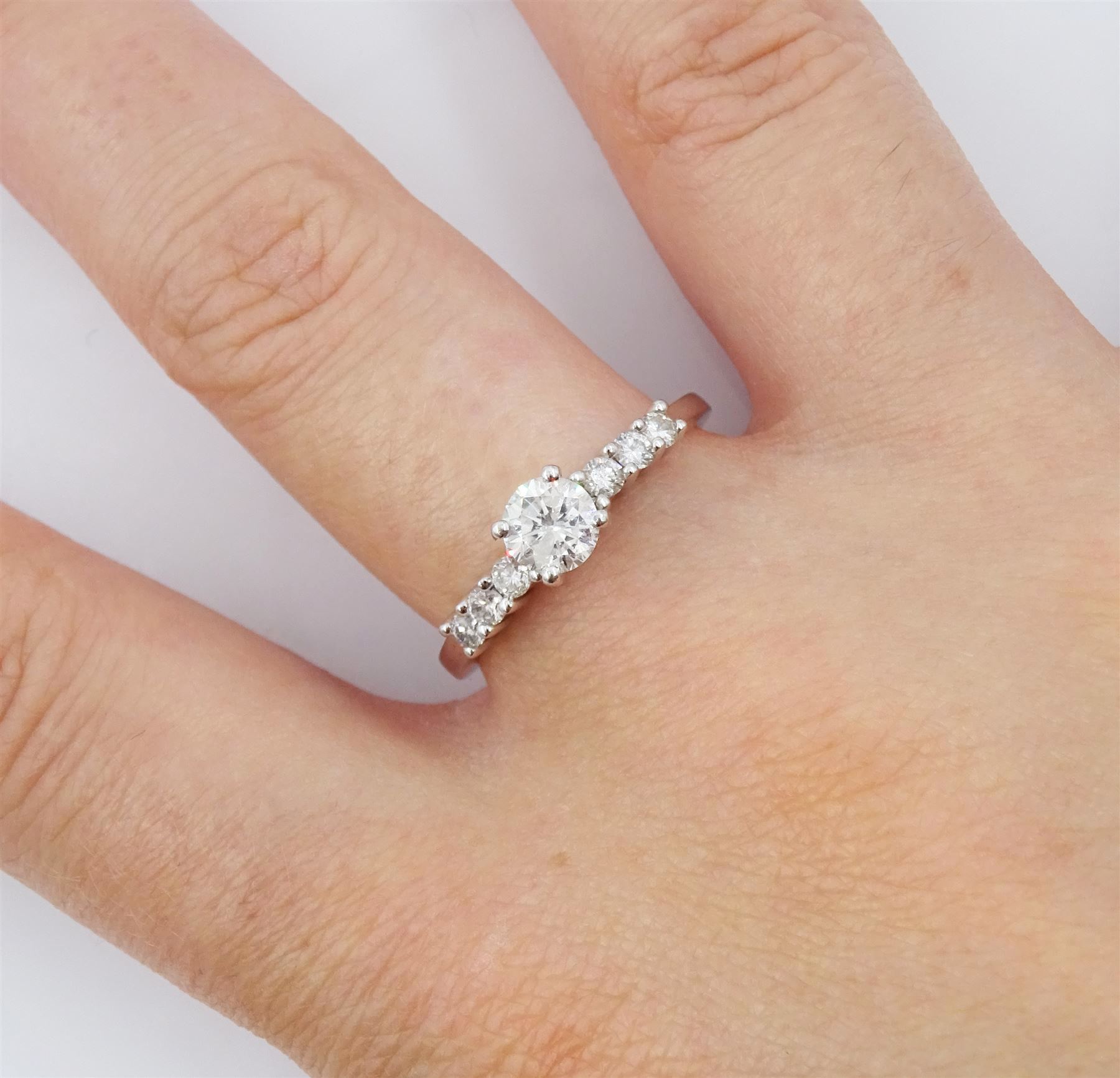 18ct white gold diamond ring, single stone round brilliant cut diamond of approx 0.50 carat, with diamond set shoulders, stamped 750