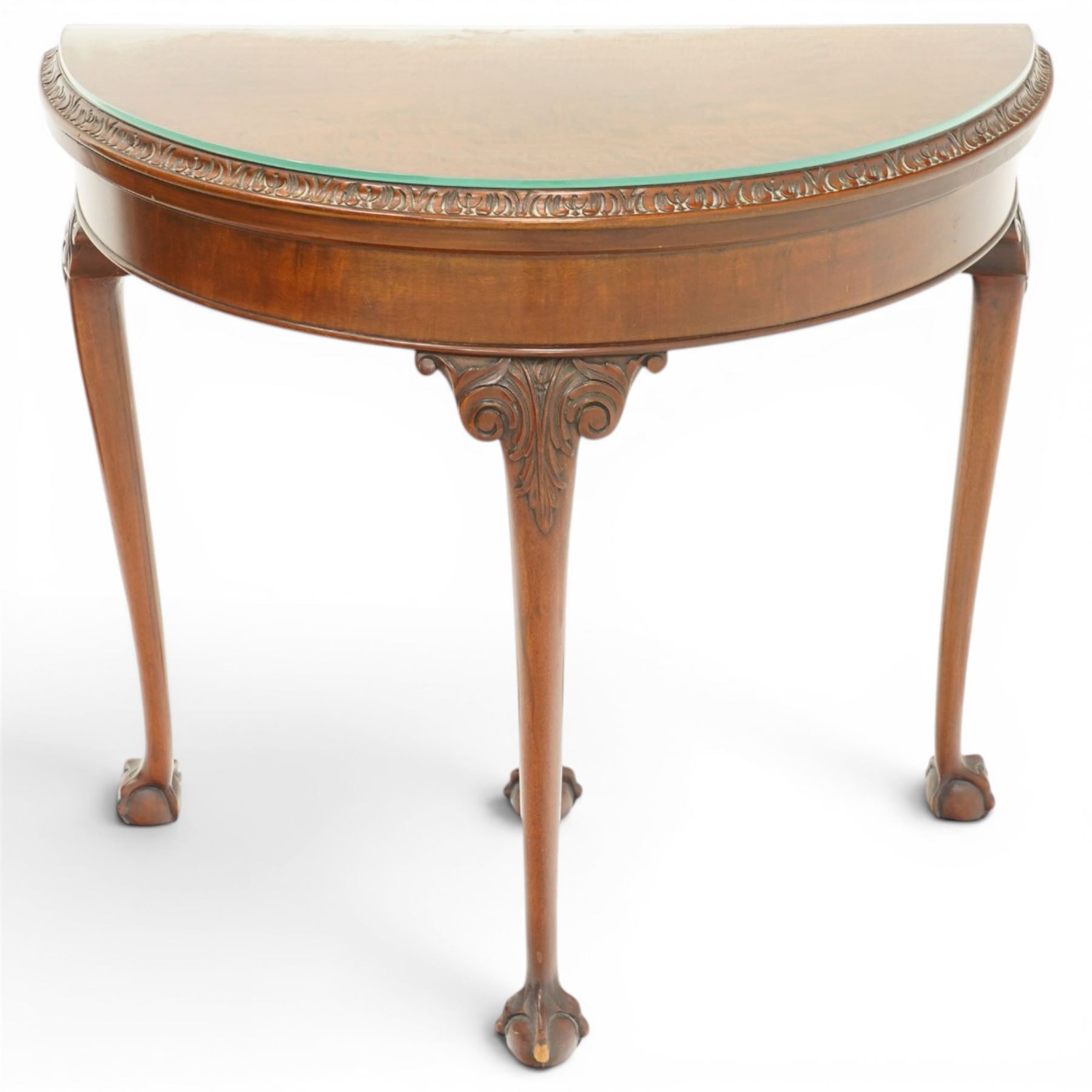Leemings of Halifax - Georgian design mahogany demi-lune card table, the lunette fold-over top with carved edge and bevelled interior, raised on cabriole supports with acanthus carved knees, with draw-action rear support, terminating to ball-and-claw feet, makers plaque to rear