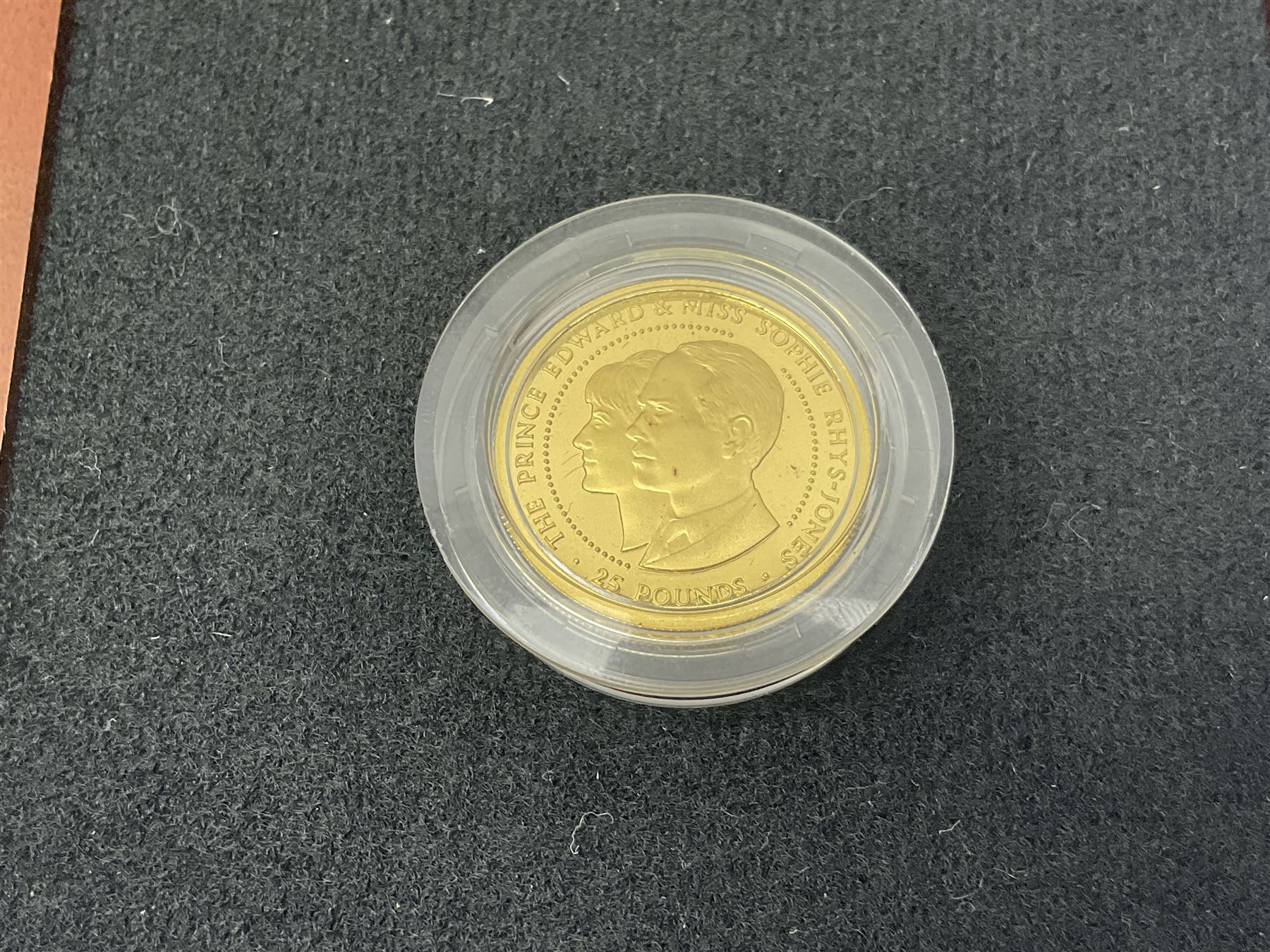 Single owner lifetime collection of mostly commemorative modern World coins with gold, silver and base metal examples, including two Queen Elizabeth II Bailiwick of Guernsey twenty-five pound gold coins 'The 1999 Royal Wedding' and '100th Anniversary of the End of the Victorian Era' 2001 each in 24 carat gold weighing 7.81 grams with certificates, silver coins commemorating the Millennium 2000 including Guyana sterling silver proof two-thousand dollars, Fiji sterling silver proof five dollars etc, silver coins from the Queen Elizabeth II Golden Jubilee Collection dated either 2002 or 2003 from Great Britain and the Commonwealth countries, United Kingdom commemorative crowns in card folders, The Royal Mint United Kingdom 1997 proof coin set in red folder without certificate etc