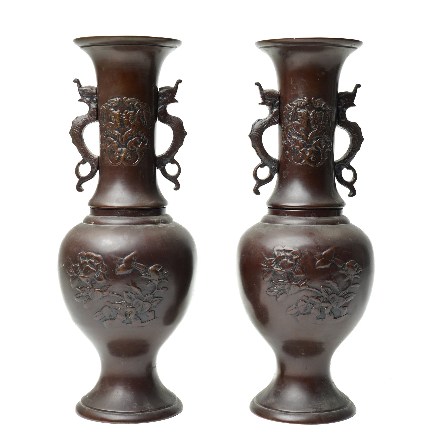 Pair of Japanese bronze vases, with twin handles in the form of dragons, decorated with flowers and traditional motifs to the neck and body, H31cm (2)