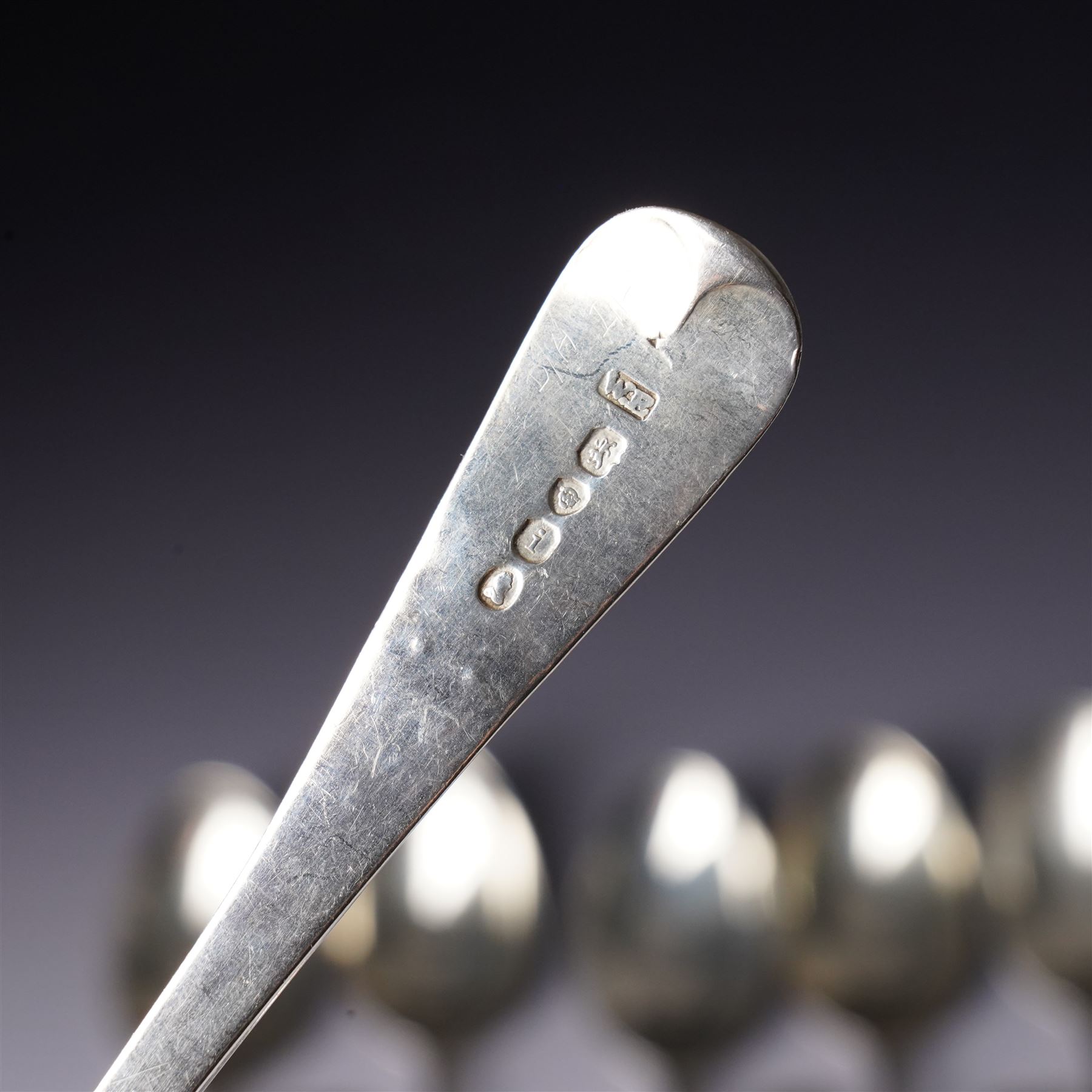 Set of six George III silver dessert spoons with bright cut stemsLondon 1818 Maker Thomas Wallis II and Jonathan Hayne, three other silver dessert spoons and a silver berry spoon with gilded bowl (10)