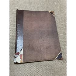 Large album of 19th century and later engravings and prints, mostly military, stuck down, album 49cm x 62cm overall