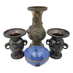 Chinese bronze vase, of baluster form with elongated neck, decorated in relief with birds amongst prunus blossom, together with a smaller pair of twin handled bronzed vases, decorated with peacocks and a blue Peking glass dish, with white metal mounted decorated with dragons, bronze vase H23.3cm