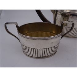 1930s American silver three piece batchelors tea service, comprising teapot, twin handled open sucrier and milk jug, each of part fluted oval form, the teapot with personal engraving to body, wood effect handle and silver urn shaped finial, stamped sterling with maker's mark for Gorham, teapot H13cm