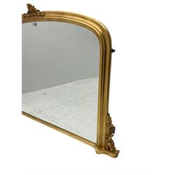 Victorian design gilt overmantel mirror, moulded arched frame with scrolled foliage cartouche pediment and brackets 