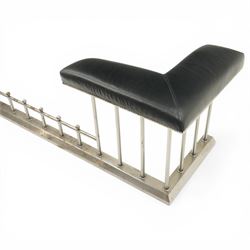 20th century steel club fender, with black leather seats above a steel frame
