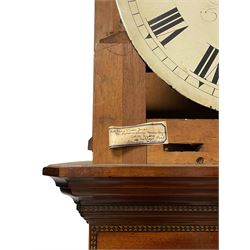 John Morgan of Aberystwyth - fine George IV mahogany 8-day longcase clock c1820, with a raised swan necked pediment, ball and eagle finial and deep inlaid frieze beneath, square hood door with a glazed circular wooden bezel and canted corners, long trunk with reeded quarter columns and a wavy topped door, rectangular plinth on bracket feet, circular painted dial with Roman numerals, minute track, makers name, and brass stamped hands, rack striking four pillar movement with a recoil anchor escapement, striking the hours on a bell. With weights and pendulum. 
John Morgan is recorded as working in Aberystwyth 1816-35. 