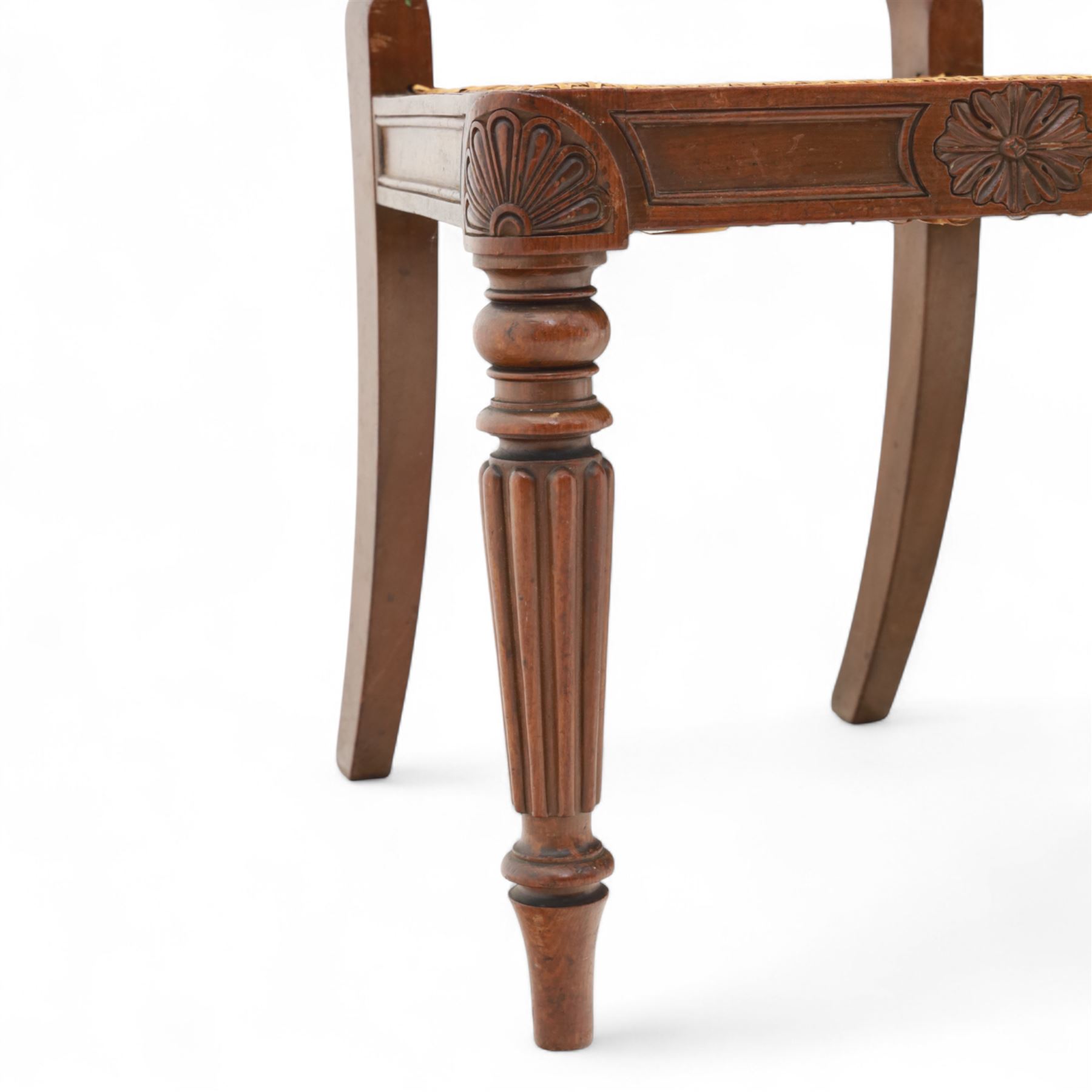 Gillows - Set of six mahogany dining chairs, each with curved top rail carved with floral medallion and scroll detail, fluted front supports, caned seats, the seat rail underside stamped HH identified as H. Howse an apprentice cabinetmaker at Gillows.