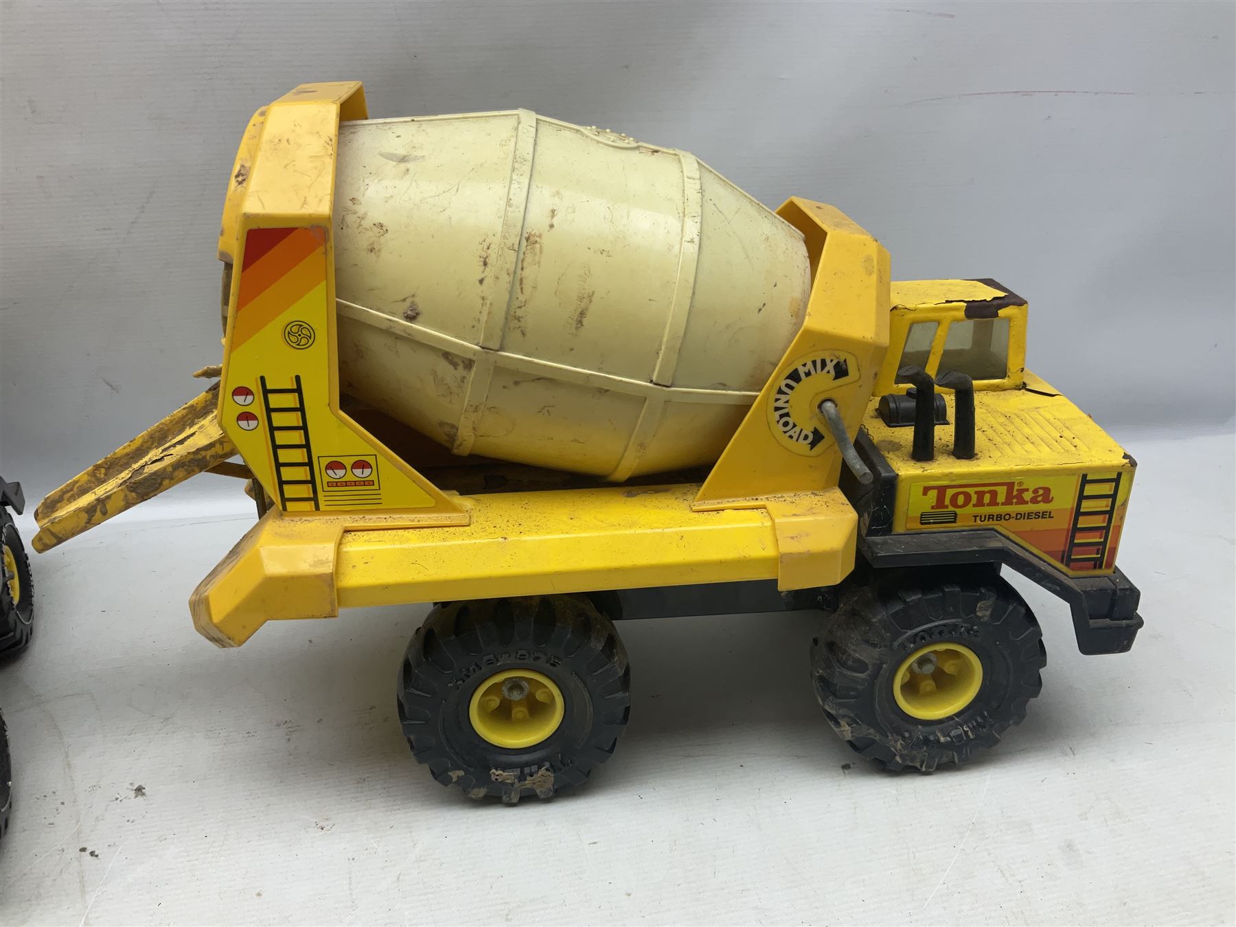 Tonka - five large scale pressed steel vehicles comprising Cement Mixer, Mobile Crane, Bulldozer and two Dumper Trucks (5)