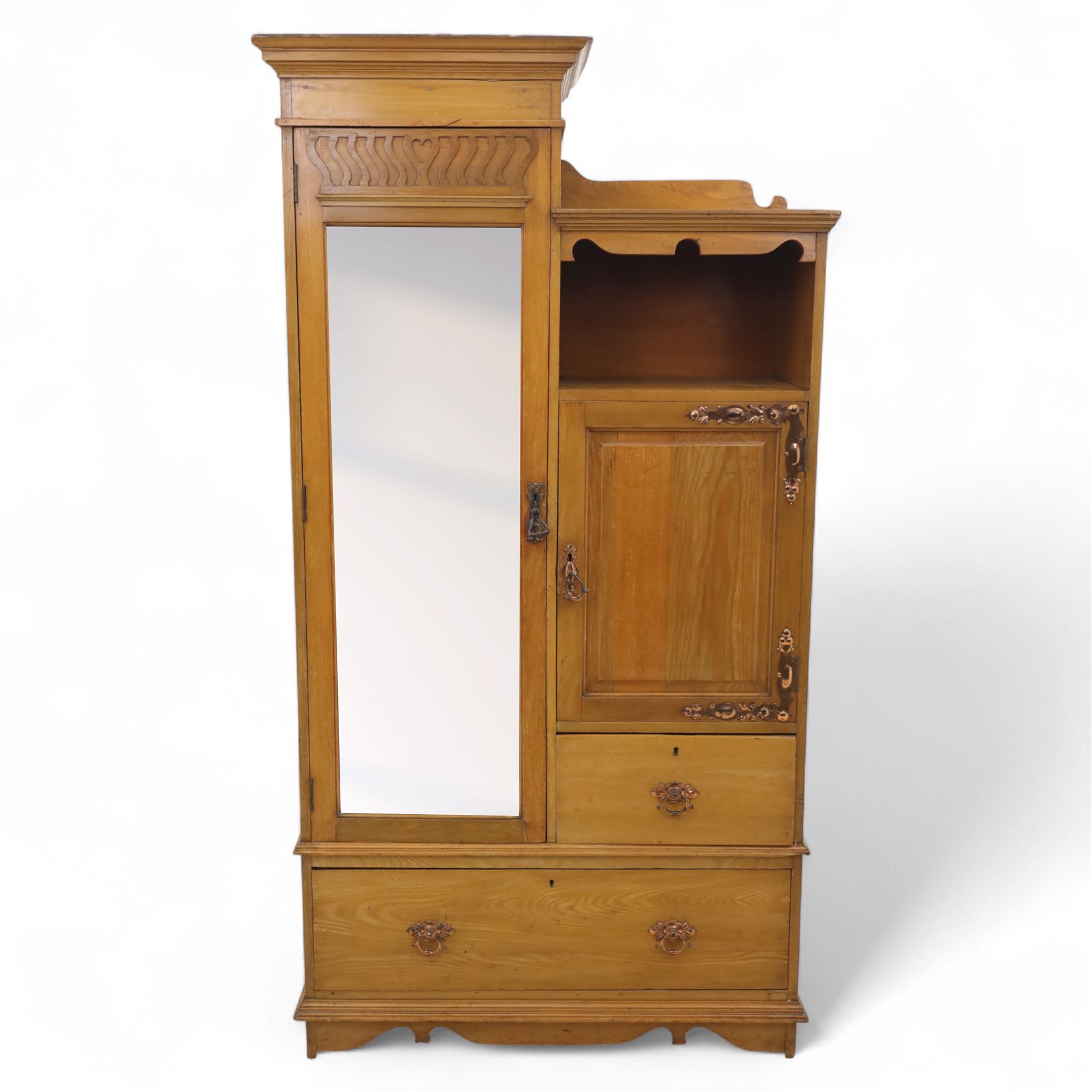 Edwardian ash combination wardrobe, moulded cornice over an open compartment and single cupboard door with carved scroll decoration, above two short and one long drawer fitted with brass handles, on shaped bracket supports