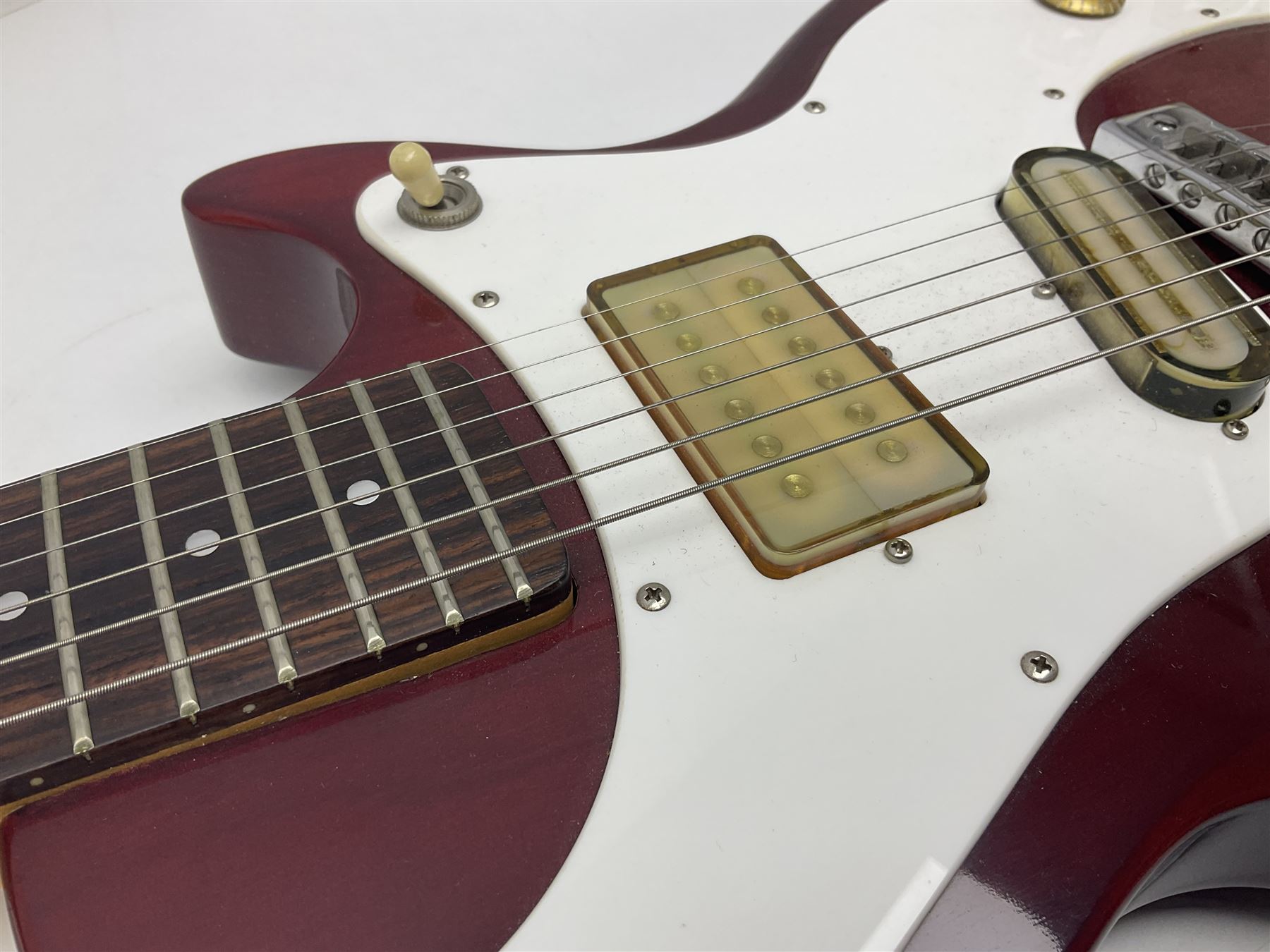 Gibson Marauder style six-string electric guitar with cherry coloured body, marked made in Japan L101cm; in locking hard carrying case