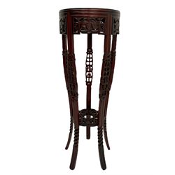 Chinese style hardwood jardiniere stand, decorated with pierced panels and carved motifs (H87cm), reproduction mahogany circular occasional table (D60cm, H53cm), and a mahogany fire screen with needle work panel depicting peacock (H92cm)