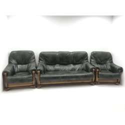 Three seat oak framed sofa upholstered in dark green leather (W180cm) and two matching armchairs (W90cm)