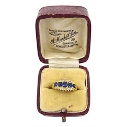 19th/early 20th century gold five stone graduating cushion cut sapphire and diamond chip three row ring, makers mark AH, stamped 18ct
