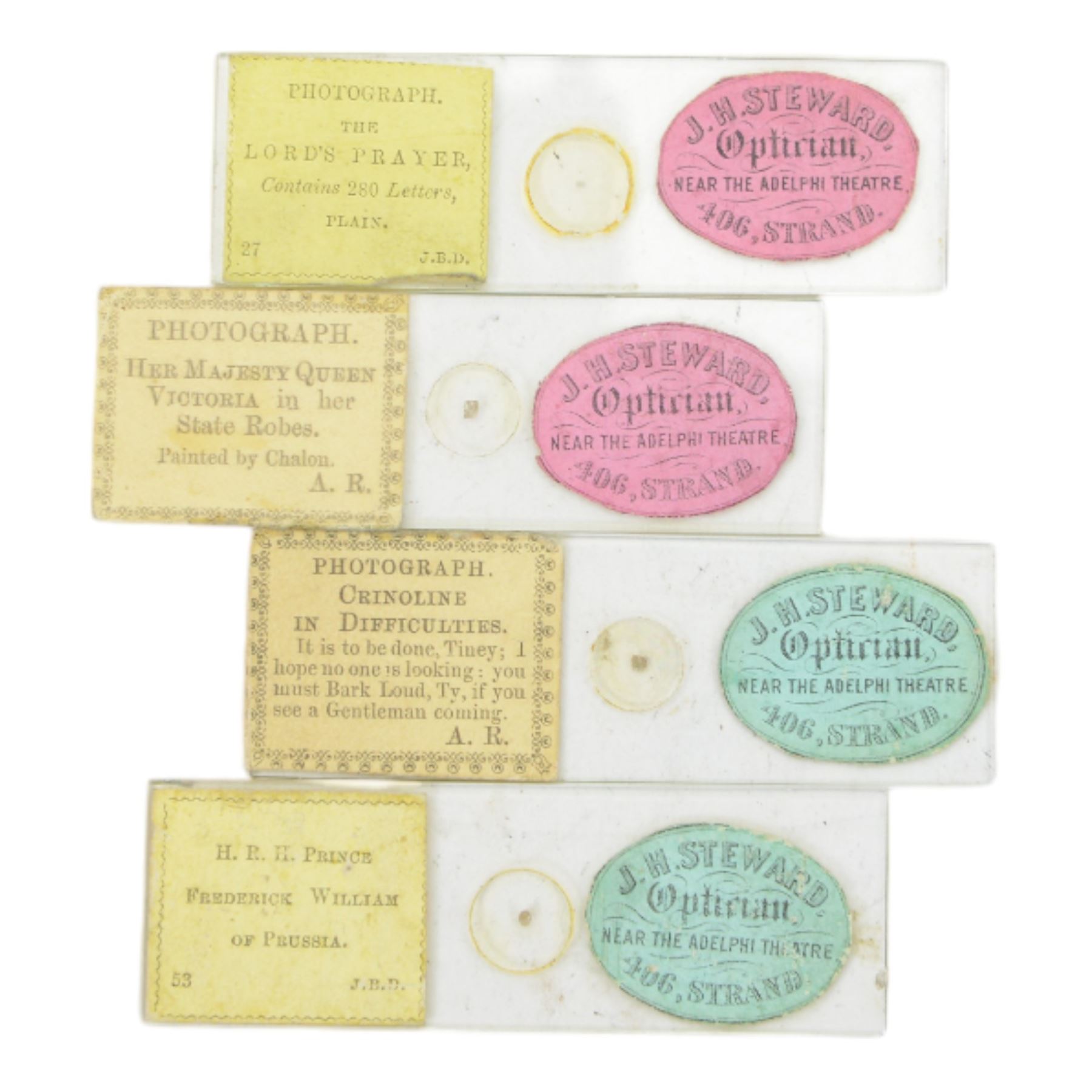 Four microphotograph slides, including two examples by John Benjamin Dancer titled HRH Prince Frederick William of Prussia and The Lords Prayer and two by Alfred Reeves titled Crinoline In Difficulties and Her Majesty Queen Victorian in her State Robes, all with retail sticker for J H Steward 406 The Strand, London