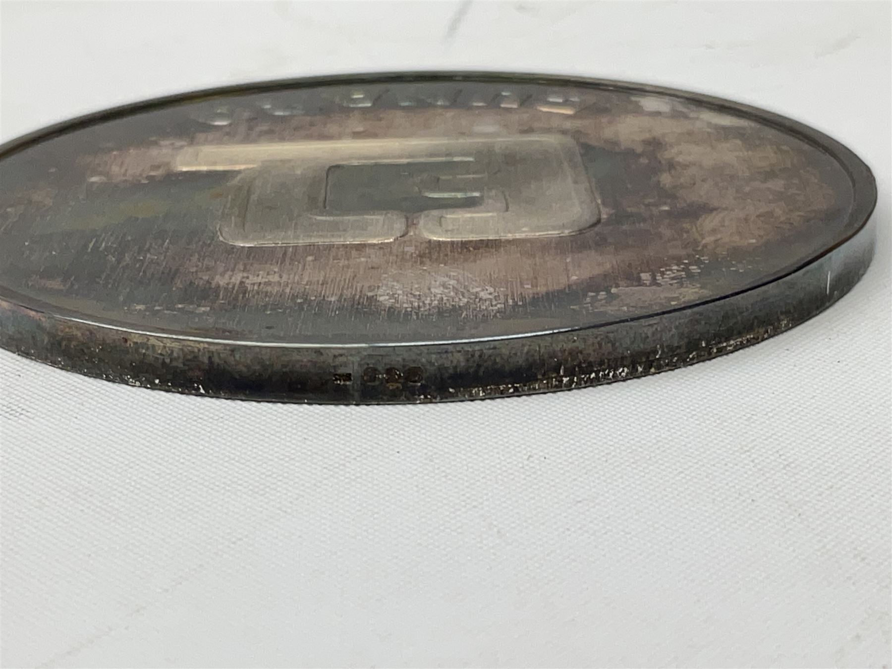 Silver 1969 Cunard RMS Queen Elizabeth maiden voyage commemorative medallion, in original Slade, Hampton & Son case with certificate, two Stratton R.M.S Queen Elizabeth mirror compacts, Stratton R.M.S Queen Mary compact, mid 20th century P&O Canberra Round World Voyage miniature globe, S.S Oriana ash tray modelled as a barrel, Norah Wellings sailor doll, and other maritime and shipping memorabilia 