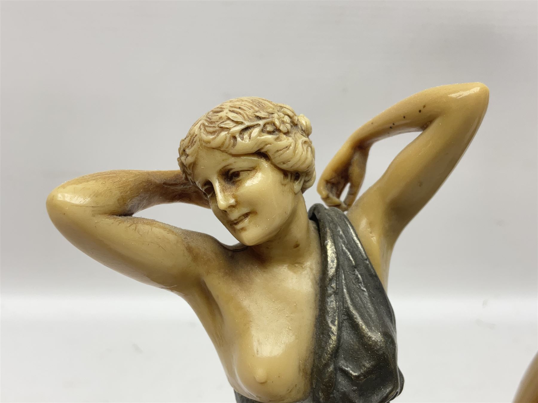 After Ferdinand Preiss (1882-1943), pair of Art Deco style, composite semi nude classical female figures, raised on circular onyx bases, H21cm