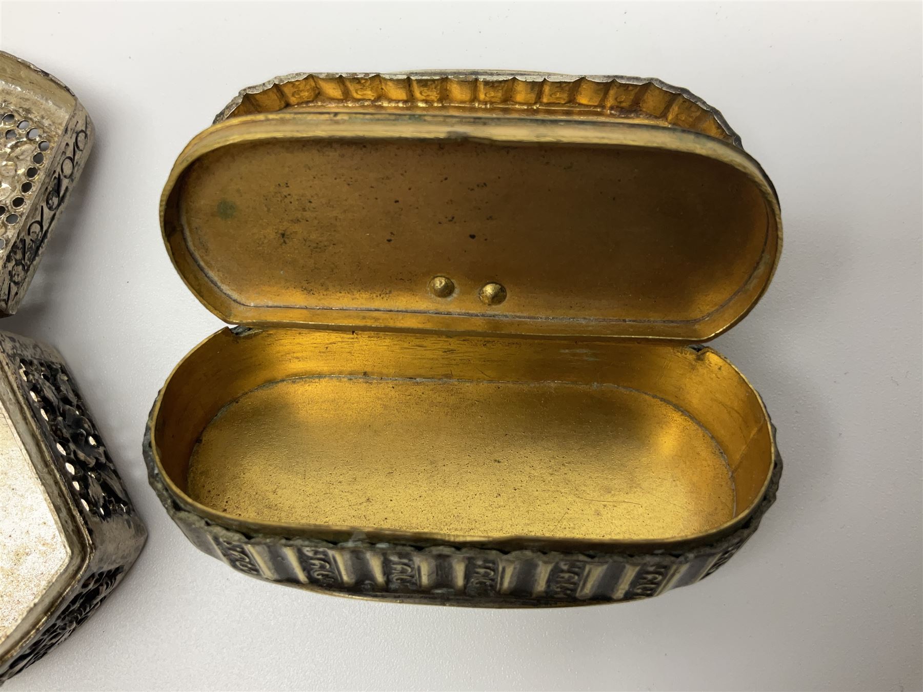 Five snuff boxes, including novelty snuff box in the form of a shoe, pierced example, rectangular hinged lid with white metal decoration and two others  