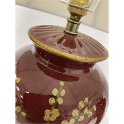 Pair of large table lamps of tapering form, decorated with Japanese blossom on a red ground, upon a square base, including shade H72cm