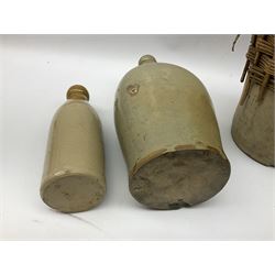 19th century stoneware gin bottle impressed I. Peck, Spirit Merchant Hull H27cm, Victorian salt glazed stoneware jar embossed W. Jefferson Mustard Manufacturer 47 Wincolmlee Hull, part cane covered stoneware flagon for John Smith Market Place Beverley and a Barton-on-Humber stoneware ginger beer bottle (4)  