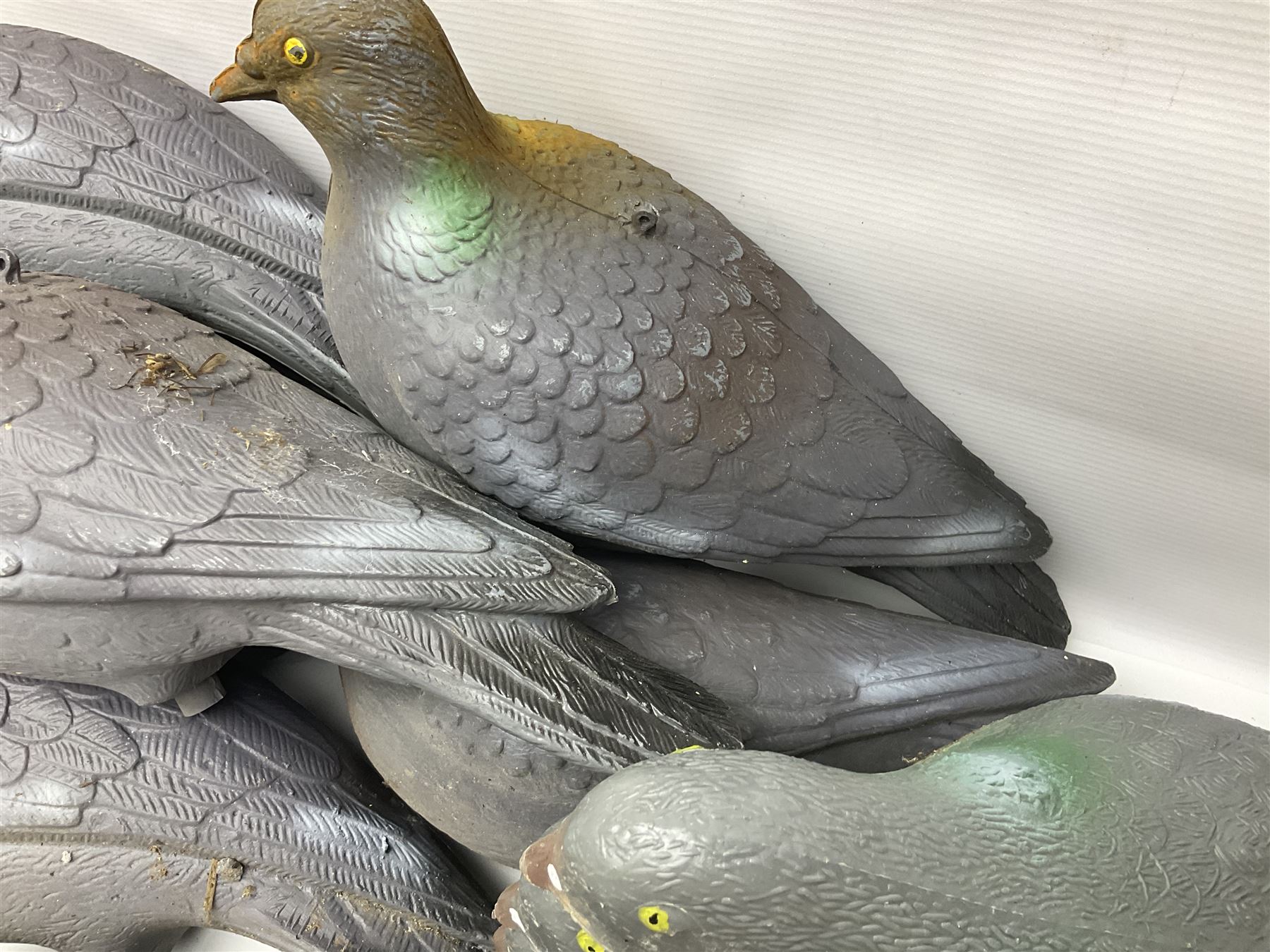 Eighteen plastic pigeon decoys comprising ten full body and eight shells with quantity of various stakes; some marked made in Italy