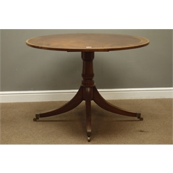 Regency style mahogany dining table, circular figured mahogany and brass inlaid top, turned pedestal with four splayed supports, D108cm, H75cm  