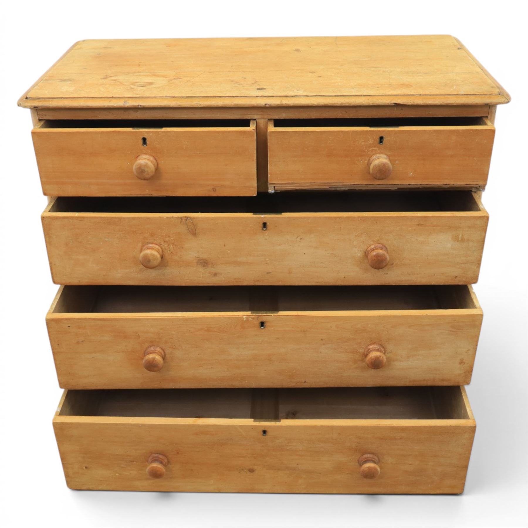 Victorian waxed pine chest, fitted with two short and three long drawers, turned wooden handles, raised on plinth base