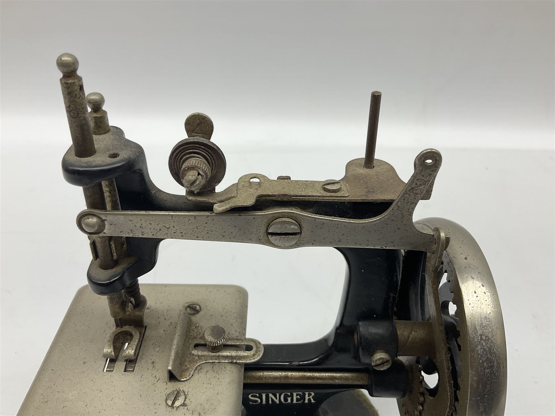 Singer mini sewing machine, together with Holly hobbie mini sewing