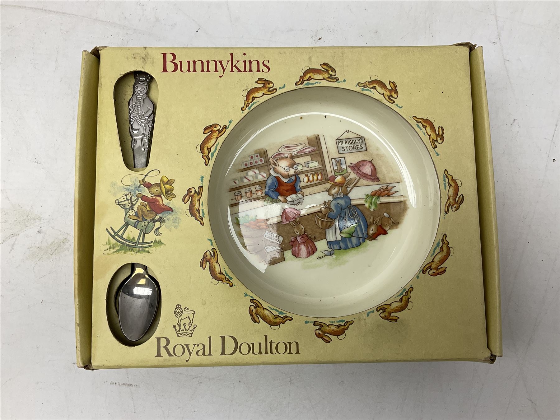 Royal Doulton Bunnykins nursery set in box and two cups, together with two Wedgwood Peter Rabbit mugs and Royal Staffordshire Noddy money box and cup (7)