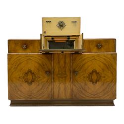 Art Deco walnut cocktail sideboard, the raised centre with hinged compartment, two drawers and two cupboards