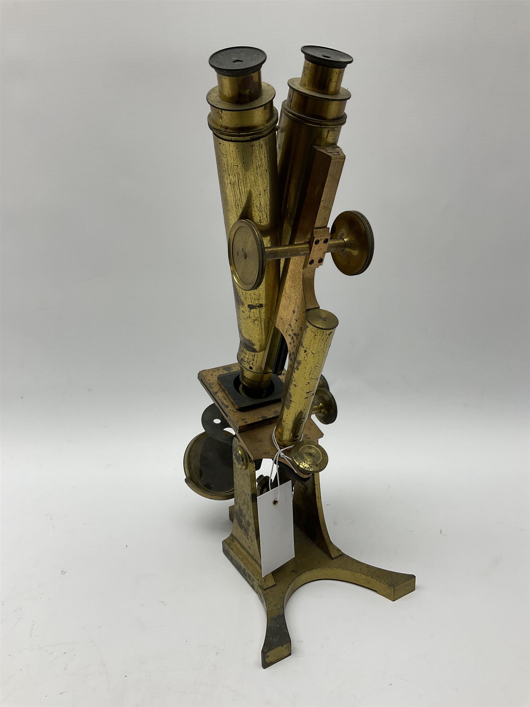 Victorian lacquered brass binocular microscope by R. & J. Beck with rack and pinion and fine focusing, stage fitted with direction adjusters above a plano/concave mirror, the main tube stamped 'R. & J. Beck 31 Cornhill London 5461' H39cm