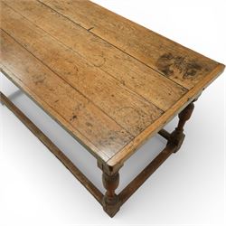 Late 17th to early 18th century oak joint refectory dining table, rectangular four plank top, raised on turned baluster legs, united by chamfered stretchers