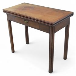 Georgian mahogany fold-over tea table, rectangular top with moulded edge over single frieze drawer with brass handle plate, on square tapering supports with gateleg
