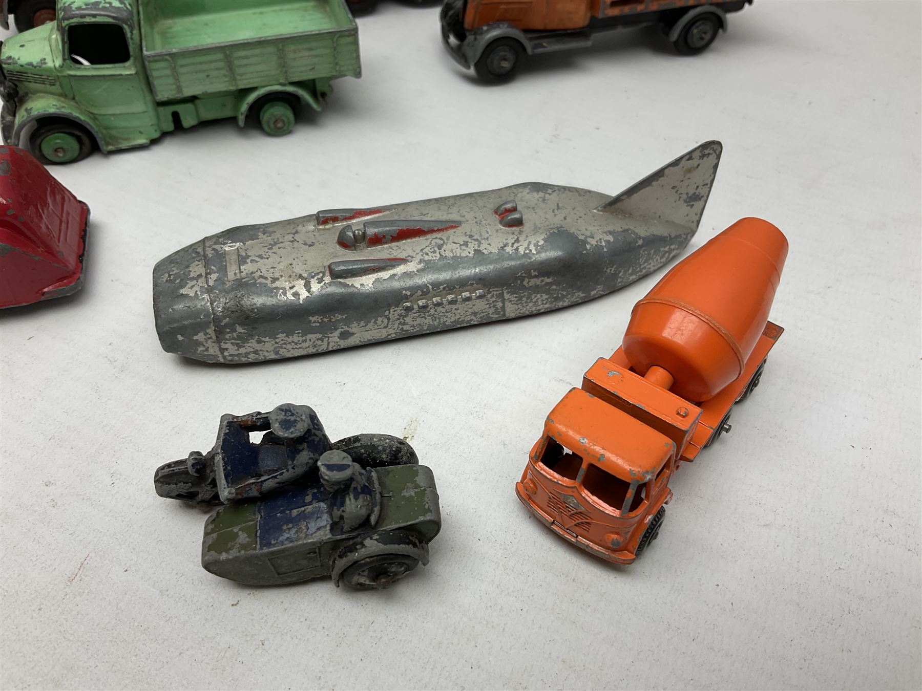 Dinky - sixteen unboxed and playworn die-cast models including Foden lorry, Big Bedford lorry with Halesowen Farm Trailer, Thunderbolt land speed record car, Spirit of the Wind racing car, market garden truck, Bedford tipper, station wagon, tanker, motorcycle combination etc; two Corgi models; and five Matchbox/Lesney models (23)