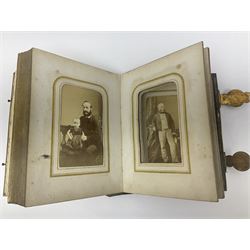Five Victorian framed Daguerreotypes and a mother of pearl inlaid leather album of Victorian photographs