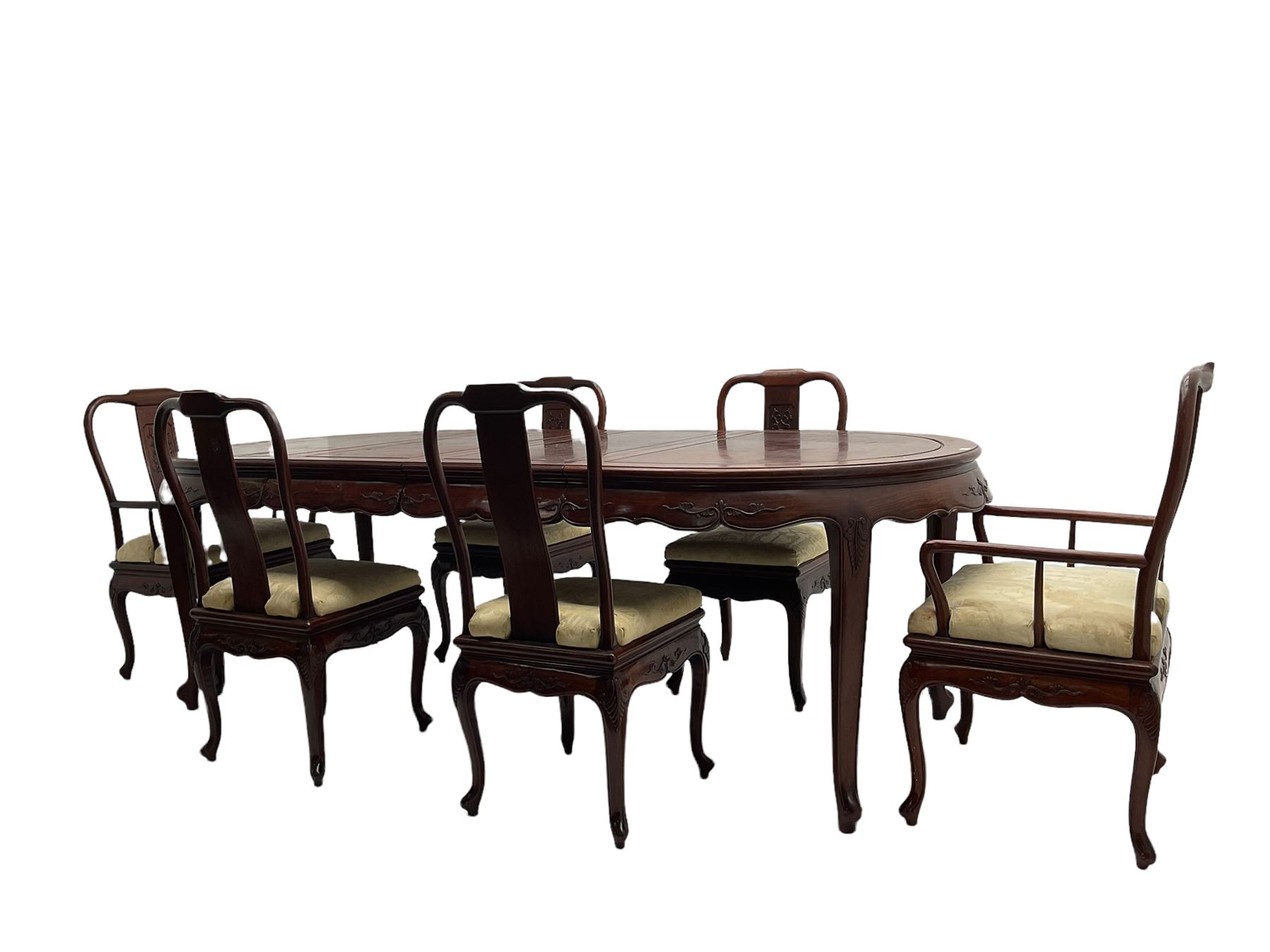 Mid to late 20th century Chinese hardwood extending dining table, two additional leaves, shaped apron carved with foliate scrolls, leaf carved cabriole supports (W246cm, H78cm, D117cm), and set six (4+2) dining chairs with shaped cresting rails over carved splats