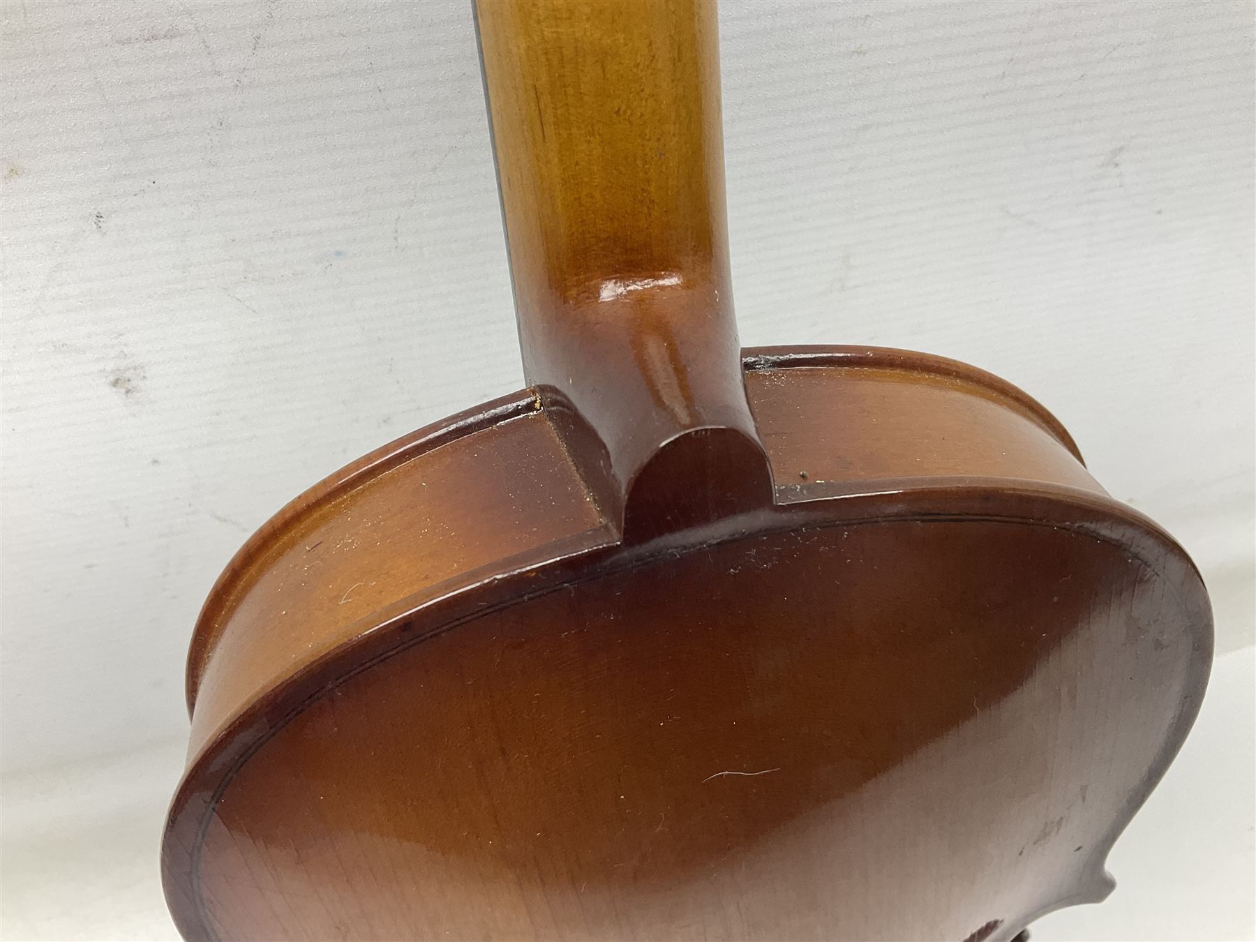 Chinese Parrot violin with 35.5cm two-piece back; L59.5cm in carrying case; and early 20th century German violin for restoration; bears label 'Antonius Stradivarius Faciebat Anno 1730'; cased with bow (2)