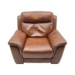 DFS - 'Liaison' reclining armchair upholstered in brown leather, upholstered in tan leather with stitched panel backrest and generously cushioned seat and arms, operated by wired remote, raised on block feet
