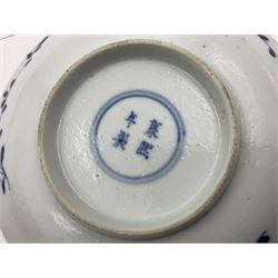 18th century Chinese blue and white Kangxi tea bowl and saucer decorated with rockwork and peonies within a border of carp swimming amongst weeds, four character Kangxi mark beneath, saucer D13cm