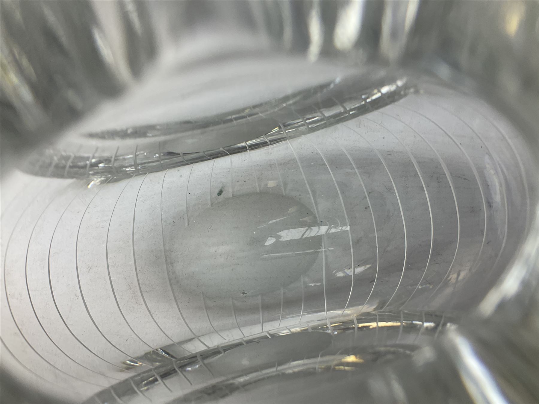 Two Orrefors Art Glass clear glass vases, the first example of compressed circular form, the second of tapering form with lobed rim, each signed beneath, tallest H14.5cm